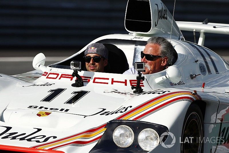 Chase Carey, Chairman, Formula One, rides in a Porsche 936 racer driven by Neel Jani