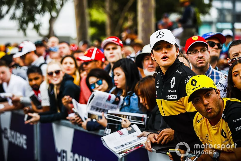 Fans wait for autographs from the drivers
