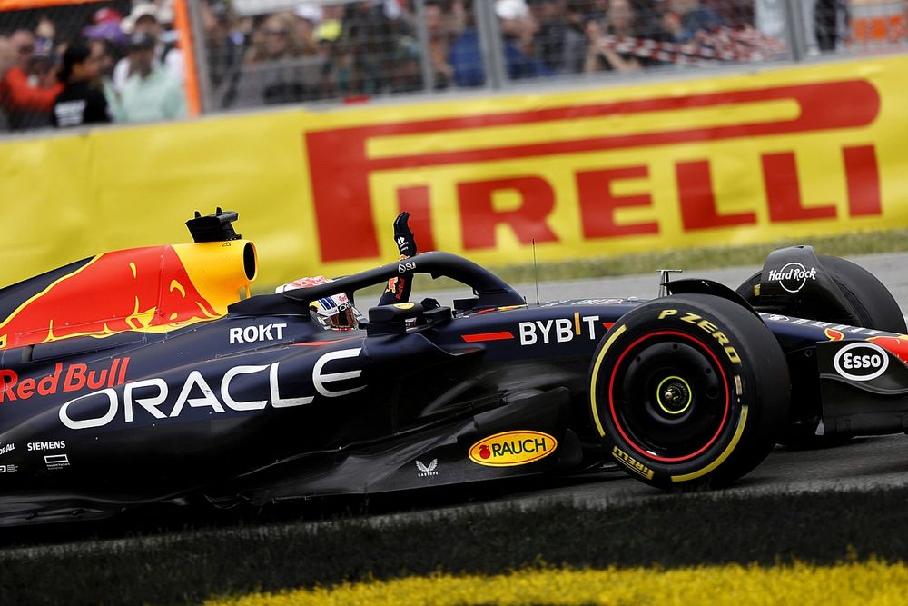 Max Verstappen, Red Bull Racing RB19, 1st position, celebrates on his way to Parc Ferme