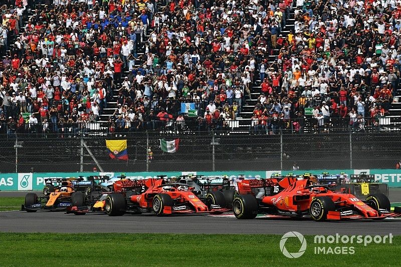 Charles Leclerc, Ferrari SF90, leads Sebastian Vettel, Ferrari SF90, Alexander Albon, Red Bull RB15, Lewis Hamilton, Mercedes AMG F1 W10, Max Verstappen, Red Bull Racing RB15, and the rest of the field at the start