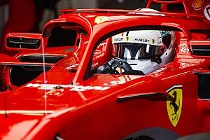 Unhappy Vettel stays silent on radio message