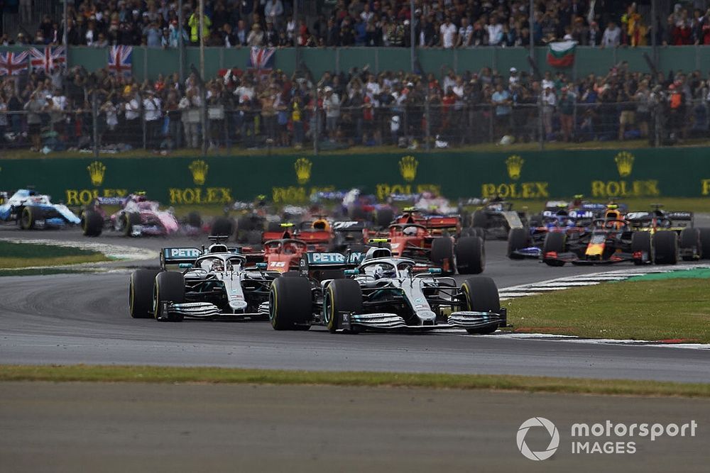 Valtteri Bottas, Mercedes AMG W10, leads Lewis Hamilton, Mercedes AMG F1 W10, Charles Leclerc, Ferrari SF90, Max Verstappen, Red Bull Racing RB15, Sebastian Vettel, Ferrari SF90, Pierre Gasly, Red Bull Racing RB15, and the rest of the field at the start