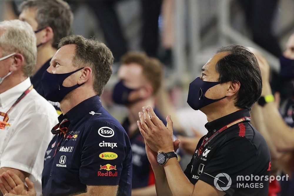 Helmut Marko, Consultant, Red Bull Racing, Christian Horner, Team Principal, Red Bull Racing, and Toyoharu Tanabe, F1 Technical Director, Honda, applaud their drivers on the podium