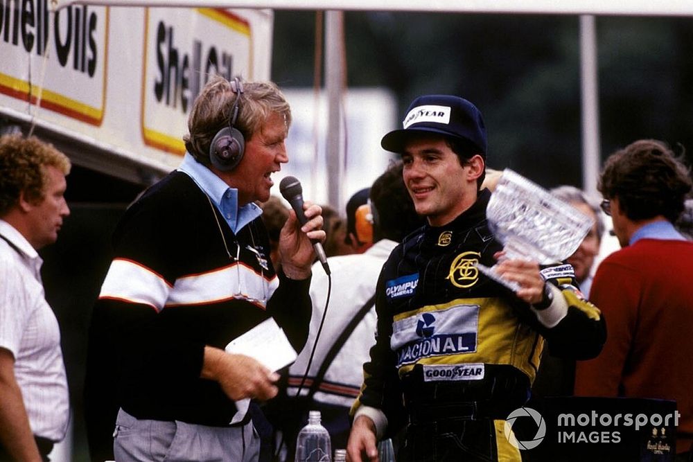 Brian Jones, the Brands Hatch commentator, interviews second place finisher Ayrton Senna, Lotus on the podium