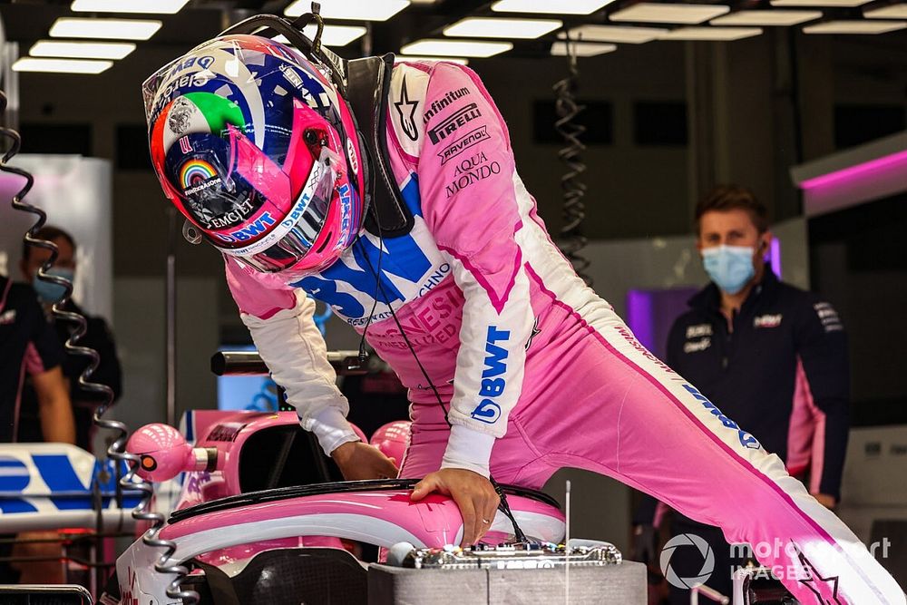 Sergio Perez, Racing Point, climbs into his cockpit