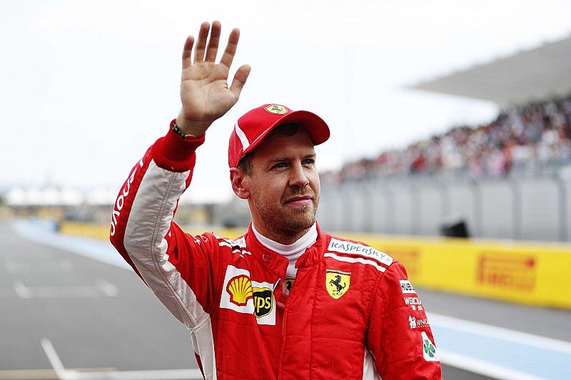 Tercero Sebastian Vettel, Ferrari