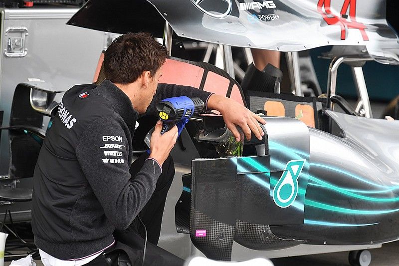 Mercedes AMG F1 mechanic works on Mercedes-AMG F1 W09 bodywork