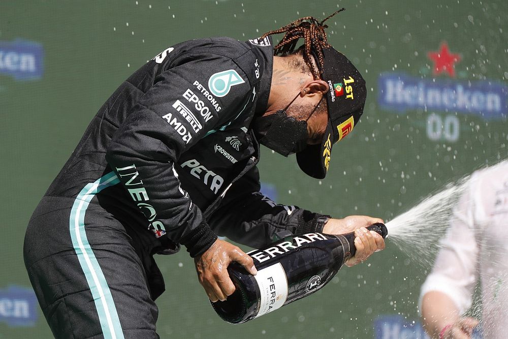 Lewis Hamilton, Mercedes on the podium celebrates winning Portugal GP