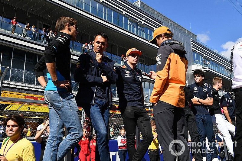 George Russell, Williams Racing, Alex Albon, Red Bull Racing, Max Verstappen, Red Bull Racing, and Lando Norris, McLaren, at the drivers parade