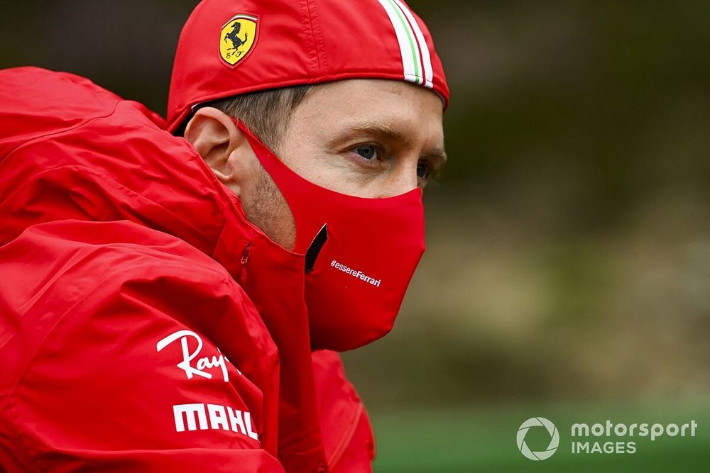 Sebastian Vettel, Ferrari walks the track on a bike 