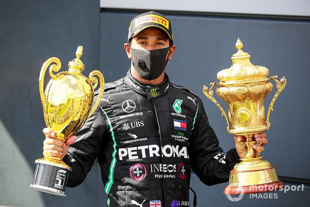 Race Winner Lewis Hamilton, Mercedes-AMG F1 with the trophies on the podium