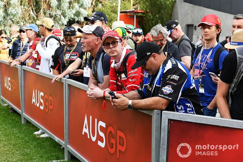 Fans queue for the dalayed opening gates