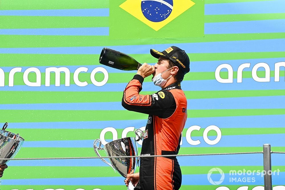 Race Winner Felipe Drugovich, MP Motorsport celebrates on the podium with the champagne