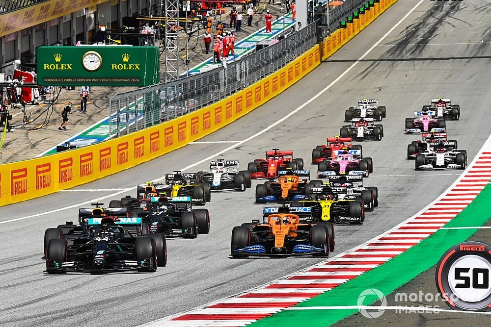 Lewis Hamilton, Mercedes F1 W11 EQ Performance, leads Max Verstappen, Red Bull Racing RB16, Carlos Sainz Jr., McLaren MCL35 Valtteri Bottas, Mercedes F1 W11 EQ Performance and the rest of the pack at the start