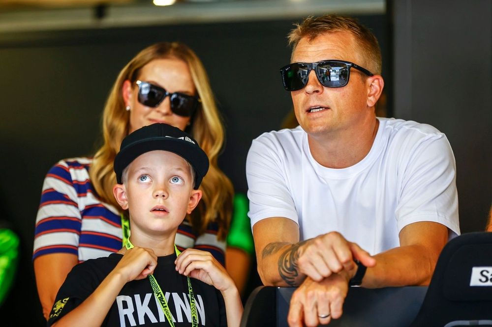 Kimi Raikkonen in the Stake F1 Team Kick Sauber garage with his son, Robin