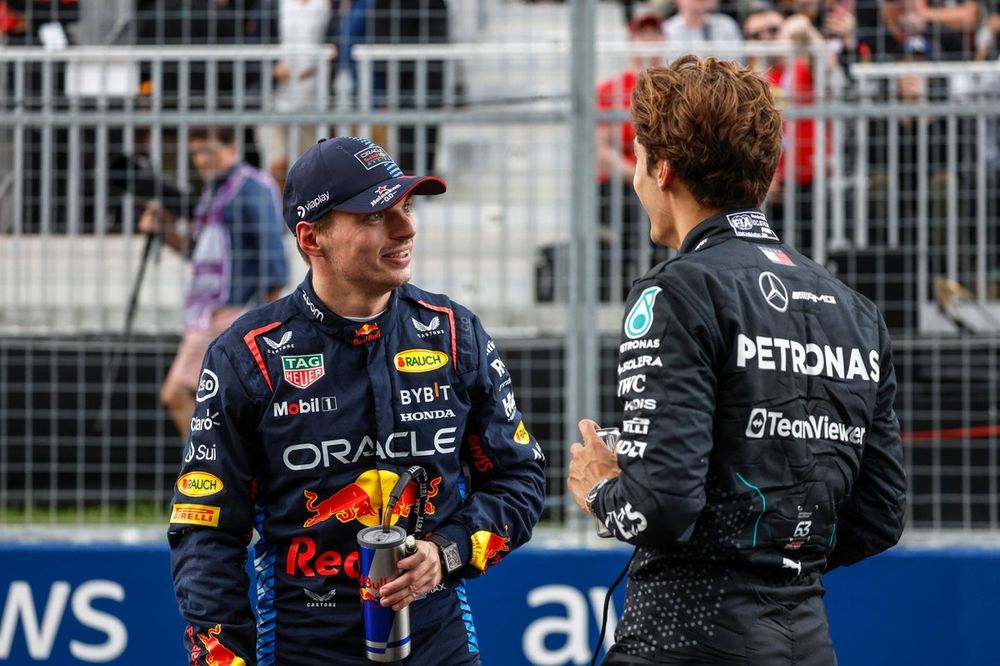 George Russell, Mercedes-AMG F1 Team, with Max Verstappen, Red Bull Racing