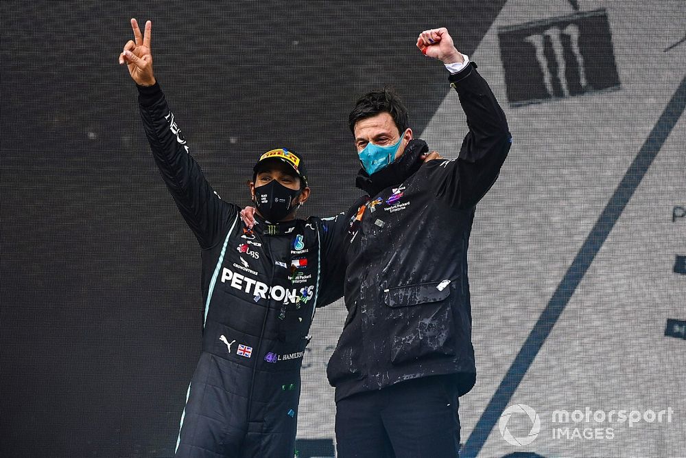 Lewis Hamilton, Mercedes-AMG F1, 1st position, and Toto Wolff, Executive Director (Business), Mercedes AMG, celebrate on the podium after securing a seventh world drivers title, on the podium