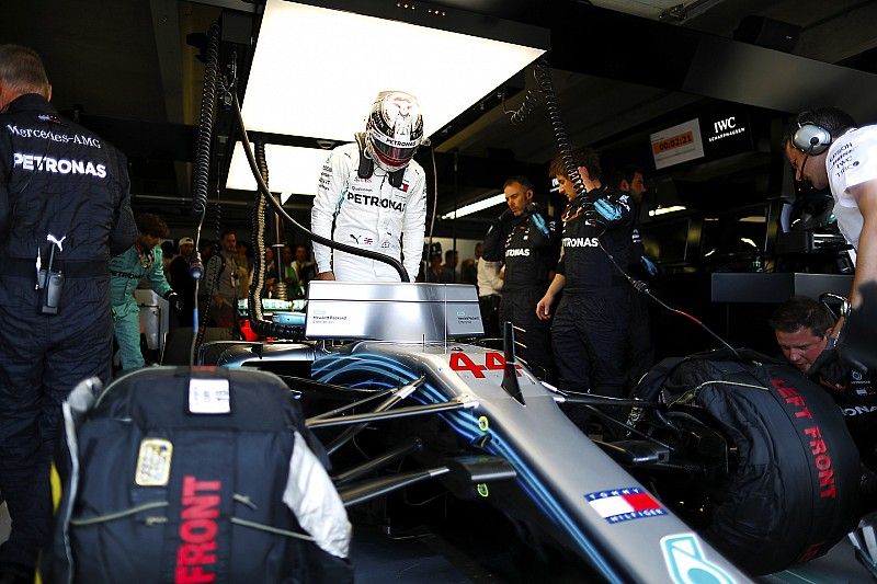 Lewis Hamilton, Mercedes AMG F1, enters his cockpit