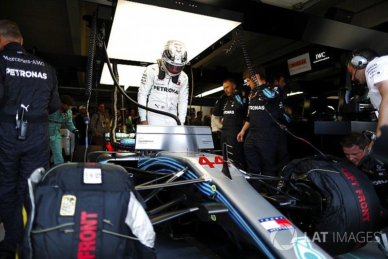 Lewis Hamilton, Mercedes AMG F1, enters his cockpit