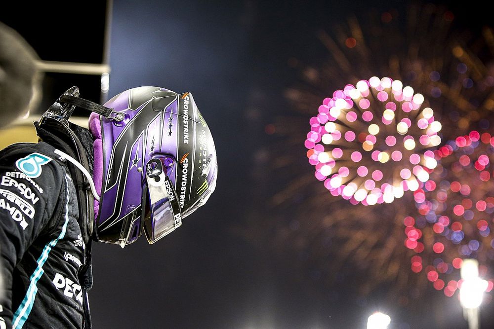 Lewis Hamilton, Mercedes, 1st position, celebrates in Parc Ferme as fireworks light the sky