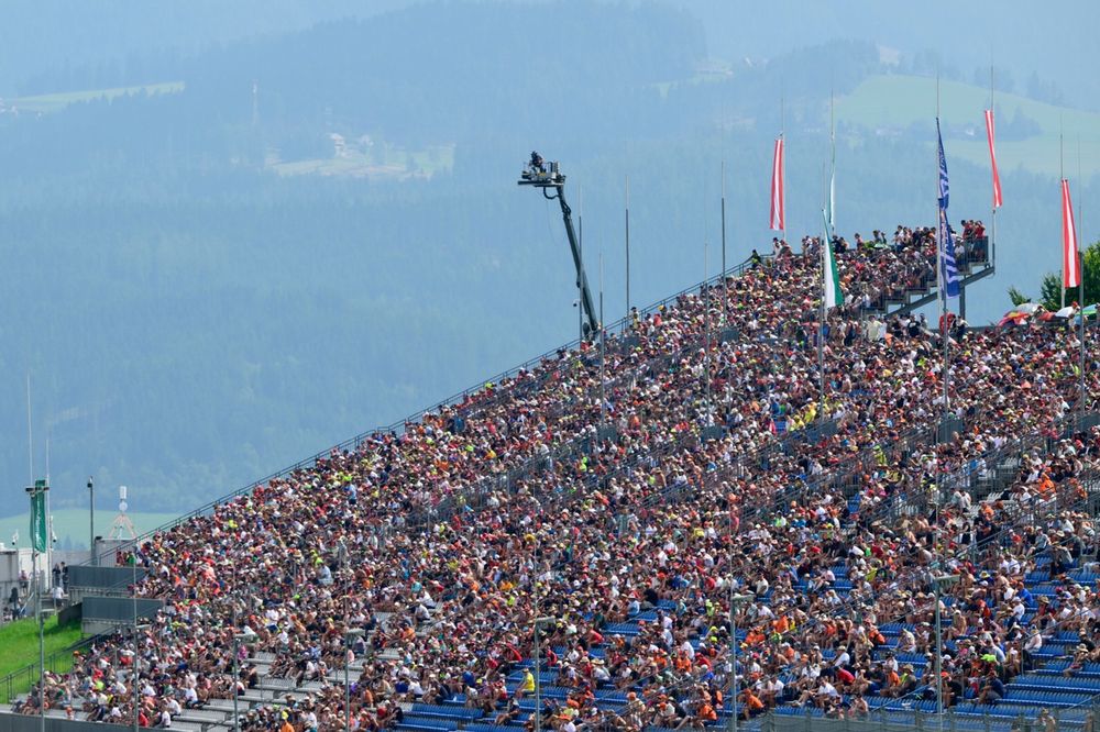  The fans enjoy the race from the grandtsands.