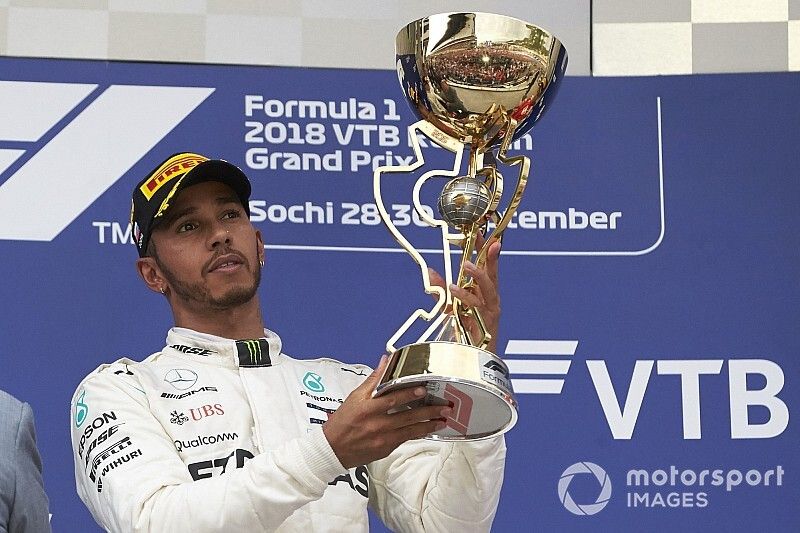 Lewis Hamilton, Mercedes AMG F1 with the trophy on the podium