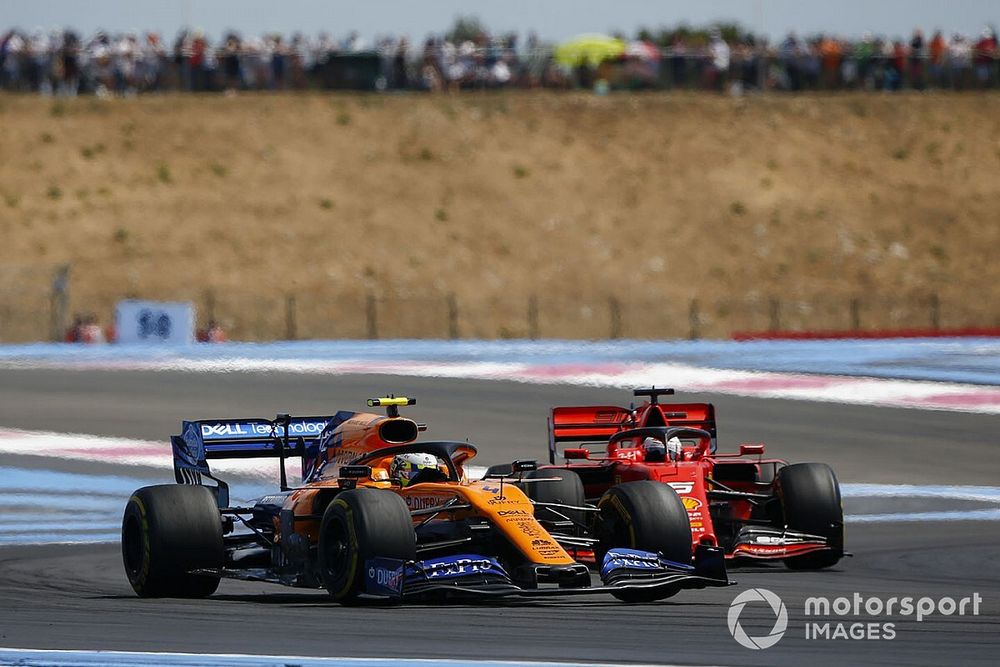 Lando Norris, McLaren MCL34, leads Sebastian Vettel, Ferrari SF90