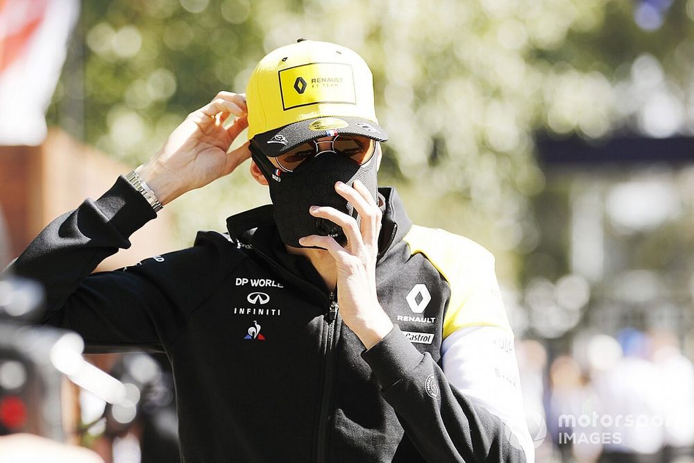 Esteban Ocon, Renault F1, arrives at the track wearing a mask and sunglasses