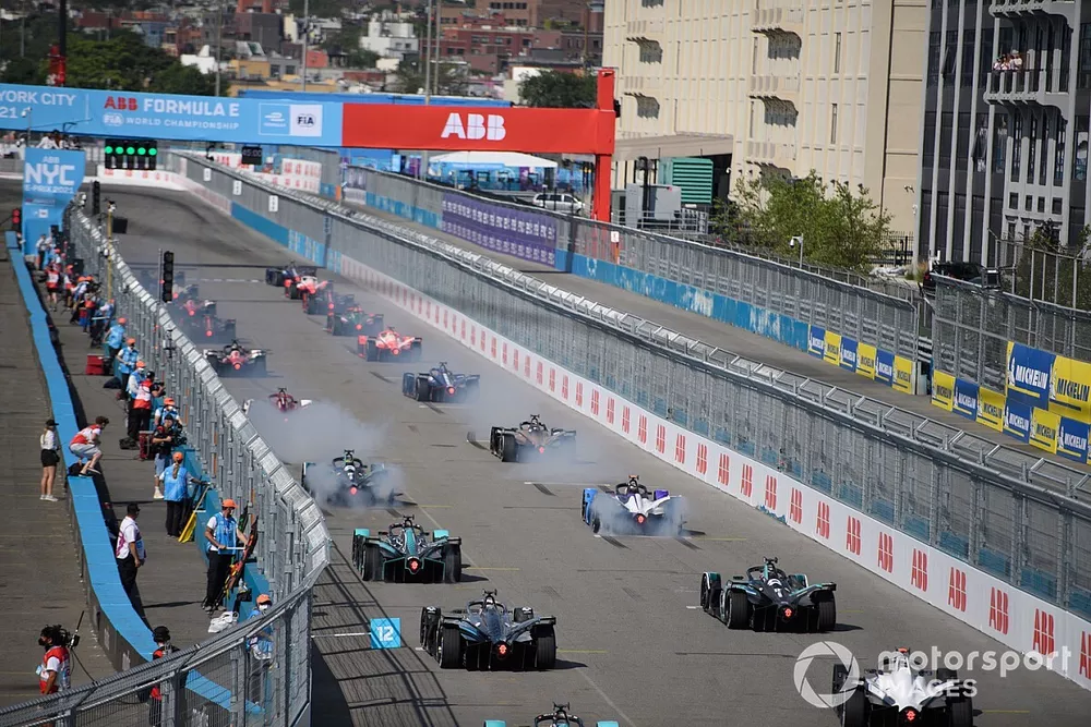 Drivers smoke their tyres at the start of the race