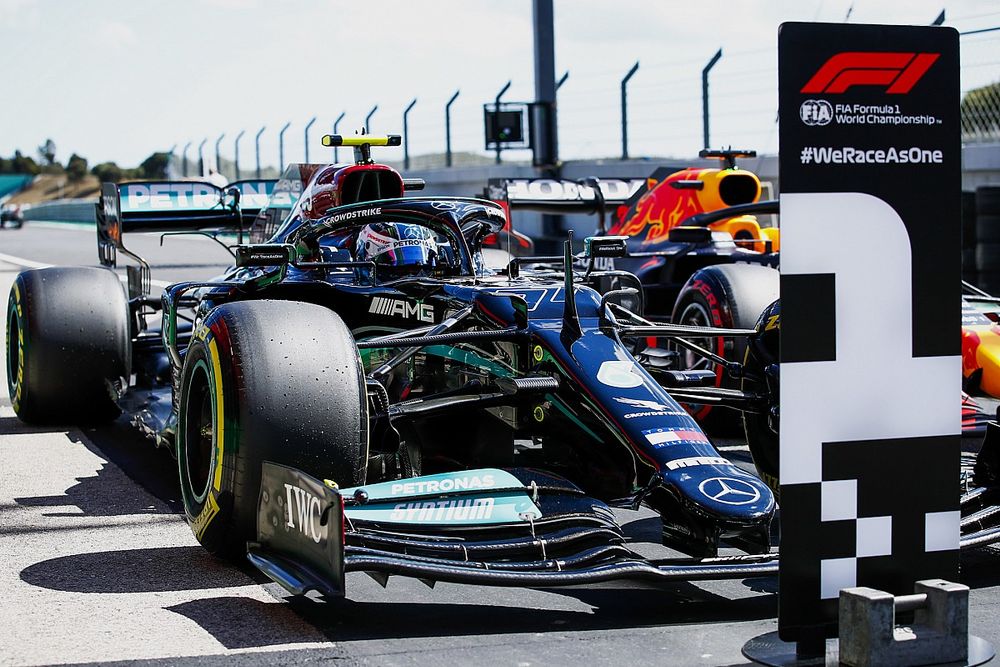 Valtteri Bottas, Mercedes W12, arrives in Parc Ferme after securing pole