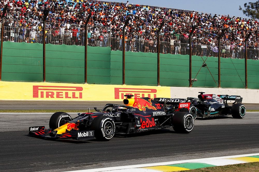 Max Verstappen, Red Bull Racing RB16B, battles with Lewis Hamilton, Mercedes W12