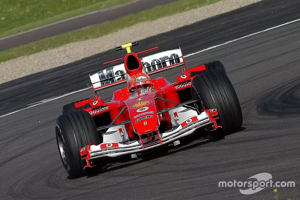 Valentino Rossi, drives the Ferrari F2004, in what was to be a top secret test and he wears one of Michael Schumacher's spare crash helmets