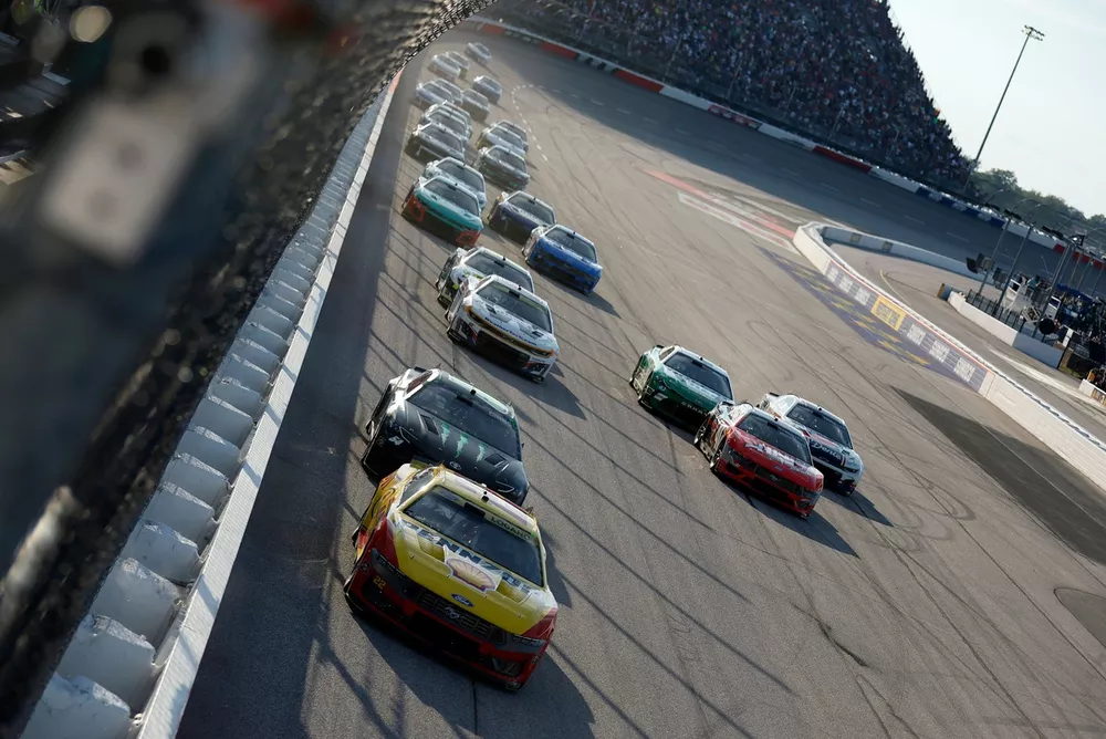 Joey Logano leads a group of cars, No. 22 Team Penske Ford