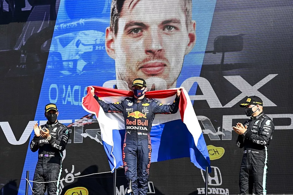Lewis Hamilton, Mercedes, 2nd position, Max Verstappen, Red Bull Racing, 1st position, and Valtteri Bottas, Mercedes, 3rd position, on the podium