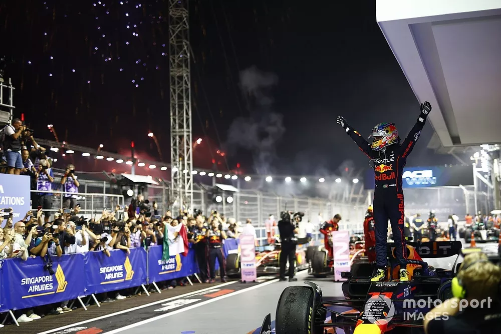 Fireworks light the sky as Sergio Perez, Red Bull Racing, 1st position, celebrates in Parc Ferme
