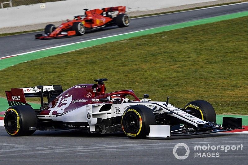 Kimi Raikkonen, Alfa Romeo Racing C38, leads Sebastian Vettel, Ferrari SF90 