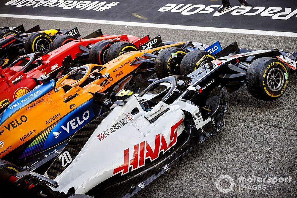 The cars of Kevin Magnussen, Haas VF-20, Carlos Sainz Jr., McLaren MCL35, Sebastian Vettel, Ferrari SF1000, in Parc Ferme after the race