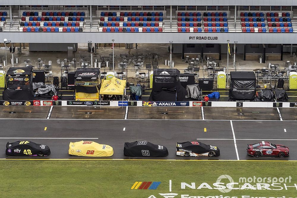 Nascar Cup cars back on the pit road due to the rain delay