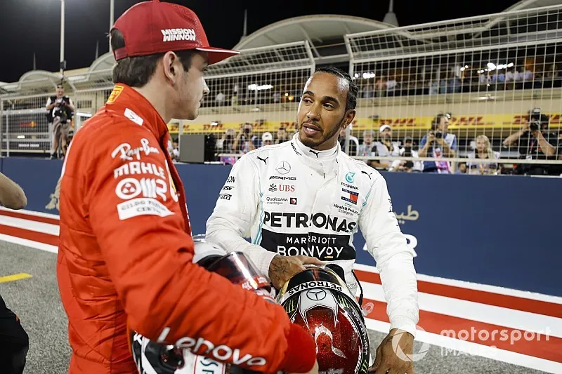Charles Leclerc, Ferrari celebrates pole position in Parc Ferme with Lewis Hamilton, Mercedes AMG F1 