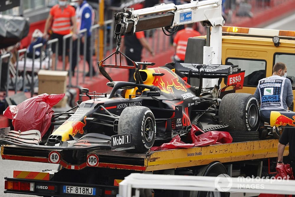 The car of Max Verstappen, Red Bull Racing RB16, is returned to the pits on a truck after the race