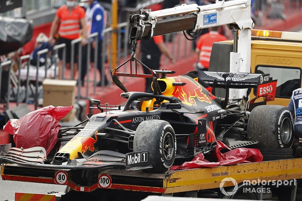 The car of Max Verstappen, Red Bull Racing RB16, is returned to the pits on a truck after the race