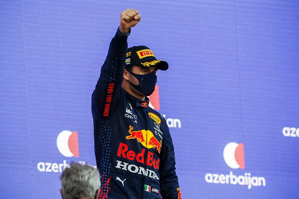 Sergio Perez, Red Bull Racing, 1st position, celebrates on the podium