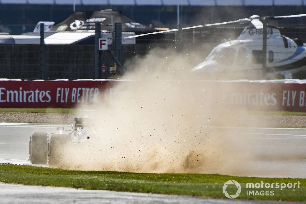 Lewis Hamilton, Mercedes F1 W11, kicks up dust and sparks