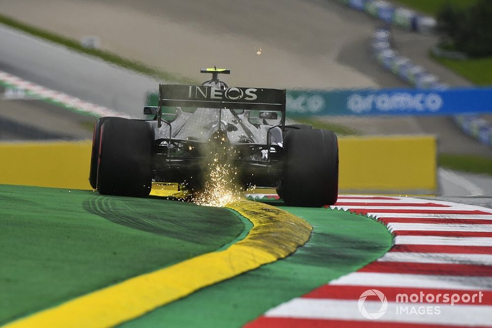 Sparks fly from the rear of Valtteri Bottas, Mercedes F1 W11