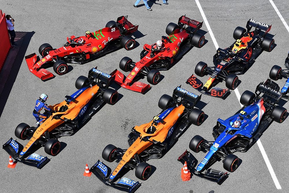 The cars of Daniel Ricciardo, McLaren MCL35M, Lando Norris, McLaren MCL35M, Esteban Ocon, Alpine A521, Carlos Sainz Jr., Ferrari SF21, Charles Leclerc, Ferrari SF21, Sergio Perez, Red Bull Racing RB16B, and Fernando Alonso, Alpine A521, in Parc Ferme