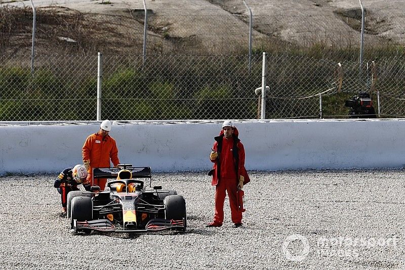 Max Verstappen, Red Bull Racing RB16, inspects his car after spinning into the gravel