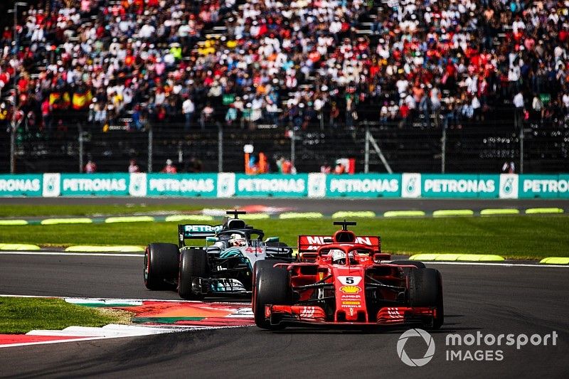 Sebastian Vettel, Ferrari SF71H, leads Lewis Hamilton, Mercedes AMG F1 W09 EQ Power+