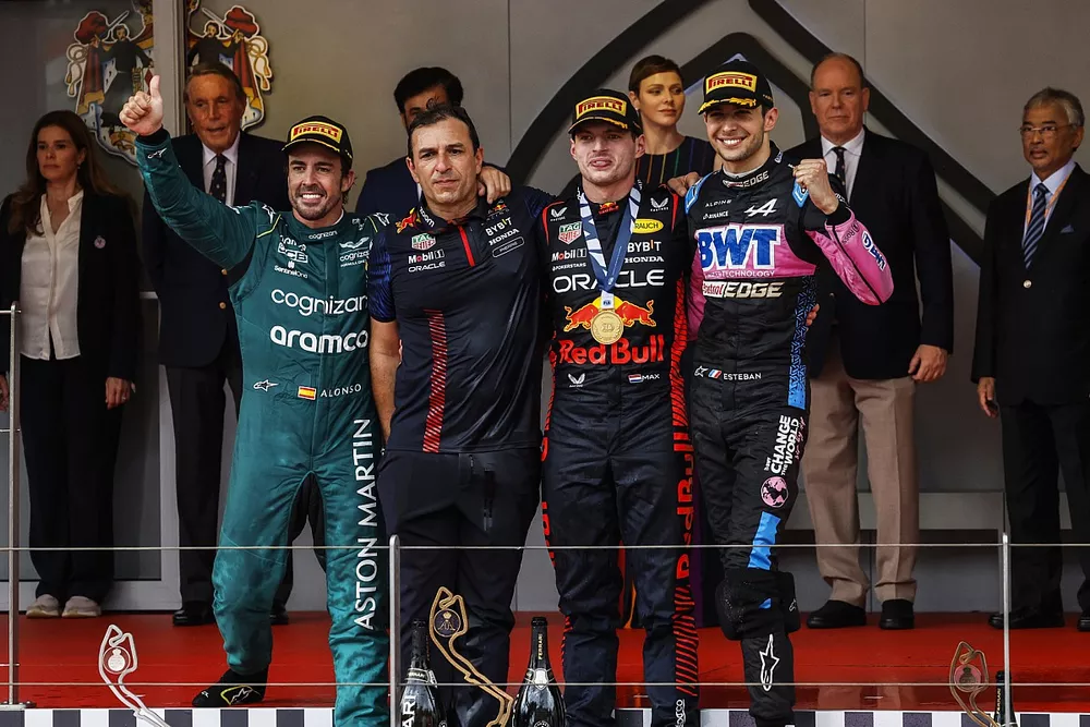 Fernando Alonso, Aston Martin F1 Team, 2nd position, the Red Bull trophy delegate, Max Verstappen, Red Bull Racing, 1st position, Esteban Ocon, Alpine F1 Team, 3rd position, on the podium