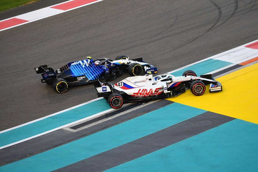 Mick Schumacher, Haas VF-21, battles with Nicholas Latifi, Williams FW43B