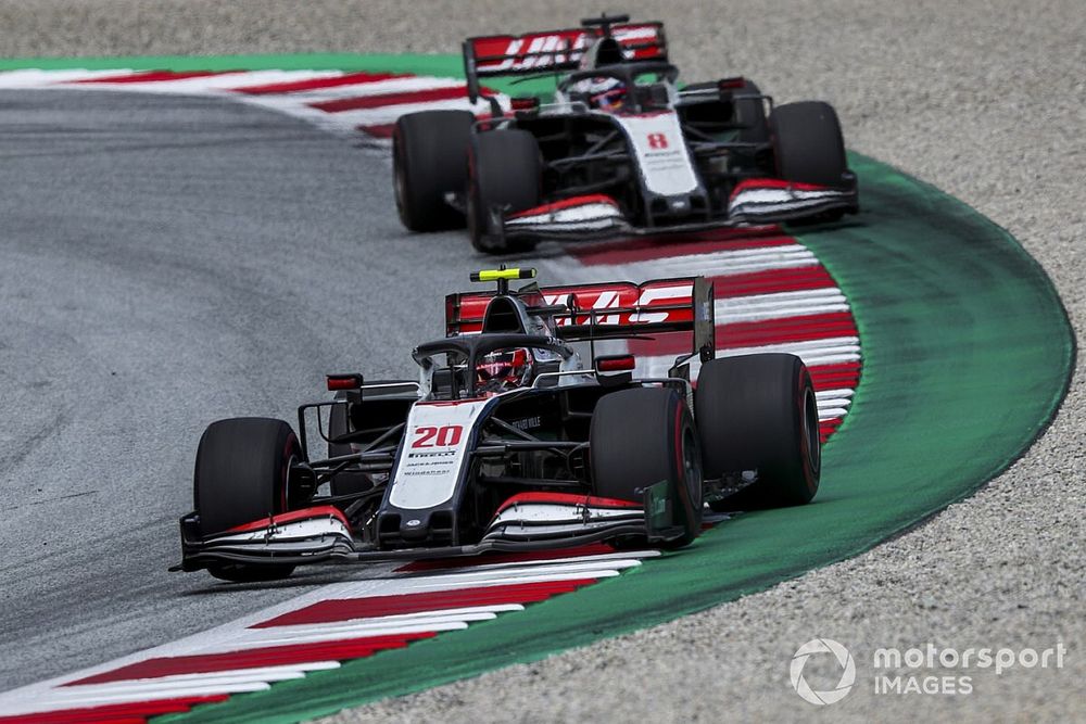 Kevin Magnussen, Haas VF-20, leads Romain Grosjean, Haas VF-20